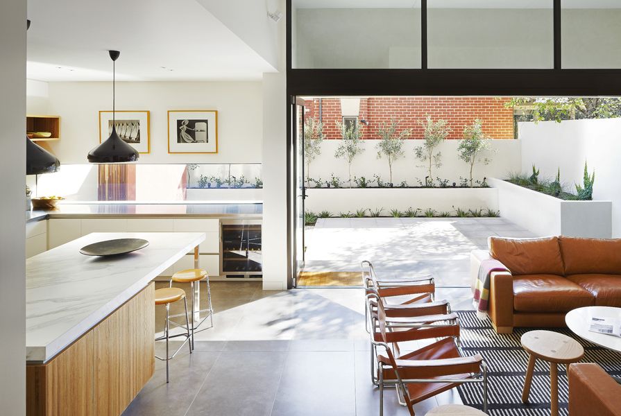 Light pours into the kitchen from the larger of two courtyards on the ground floor. Artwork: Max Dupain.