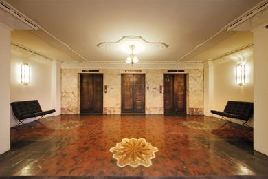 The level-11 lobby with original marble inlay flooring.