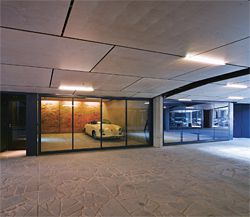  Individual garages with clear glazed doors flank the central access way. Image: Peter Bennetts. 