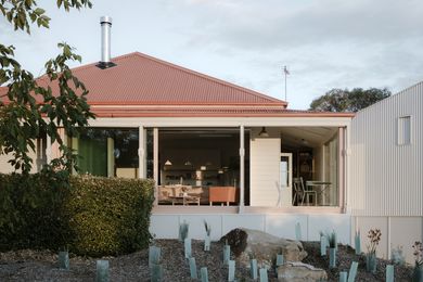 The existing bungalow has been repaired and had two new pavilions added to its edges.