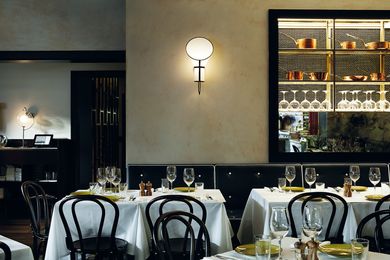 The dining room features A display of burnished copper pots and other culinary artefacts.