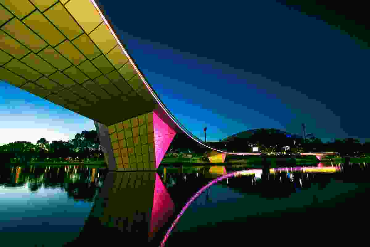 Riverbank Bridge at dusk showing lighting as seen from the south side of the Torrens, looking towards Adelaide Oval.  