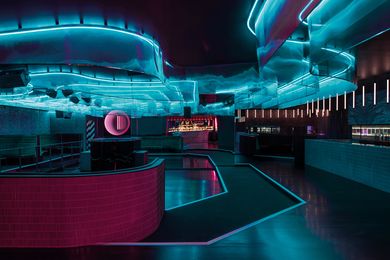 The centrepiece of the main bar is a neon sculpture suspended above the dancefloor that cycles through rich colour gradations.