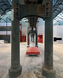 The rigorous  structural grid of the  original building is  maintained. Looking  down one of the  corridor spaces,  showing detail of the  cast-iron columns.
