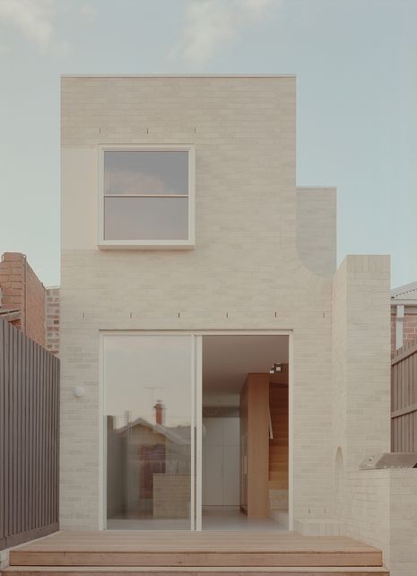 The project involved reworking the original plan and stretching the existing house to include a rectilinear ground floor extension and a set-back second storey.