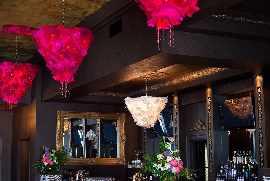 Large chandeliers add colour to a banqueting room.