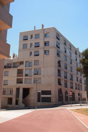 The exterior of Flores & Prats' Building 111, the main entranceway to the left.