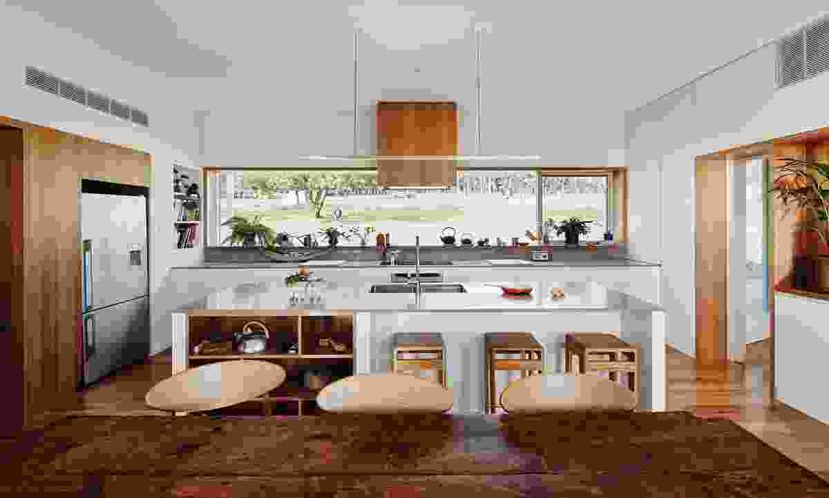 The kitchen acts as the bright core of the house, made brighter through the addition of a south-facing picture window.