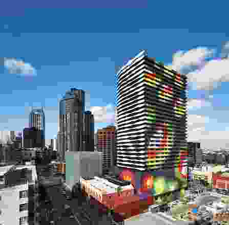 Swanston Square’s eastern and southern facades create the black-and-white image of William Barak while the northern and western facades have a multicoloured pattern reminiscent of a topographic map.