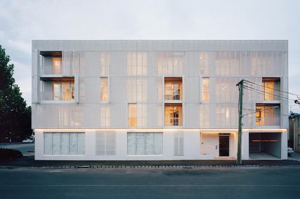 At night when the apartments are lit from within, the rhythm of life inside is projected on the building’s facade. Photograph: Rory Gardiner.
