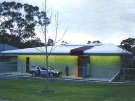 The street face of the Poll house, with its hip roof, subtly plays off the surrounding suburban environment.