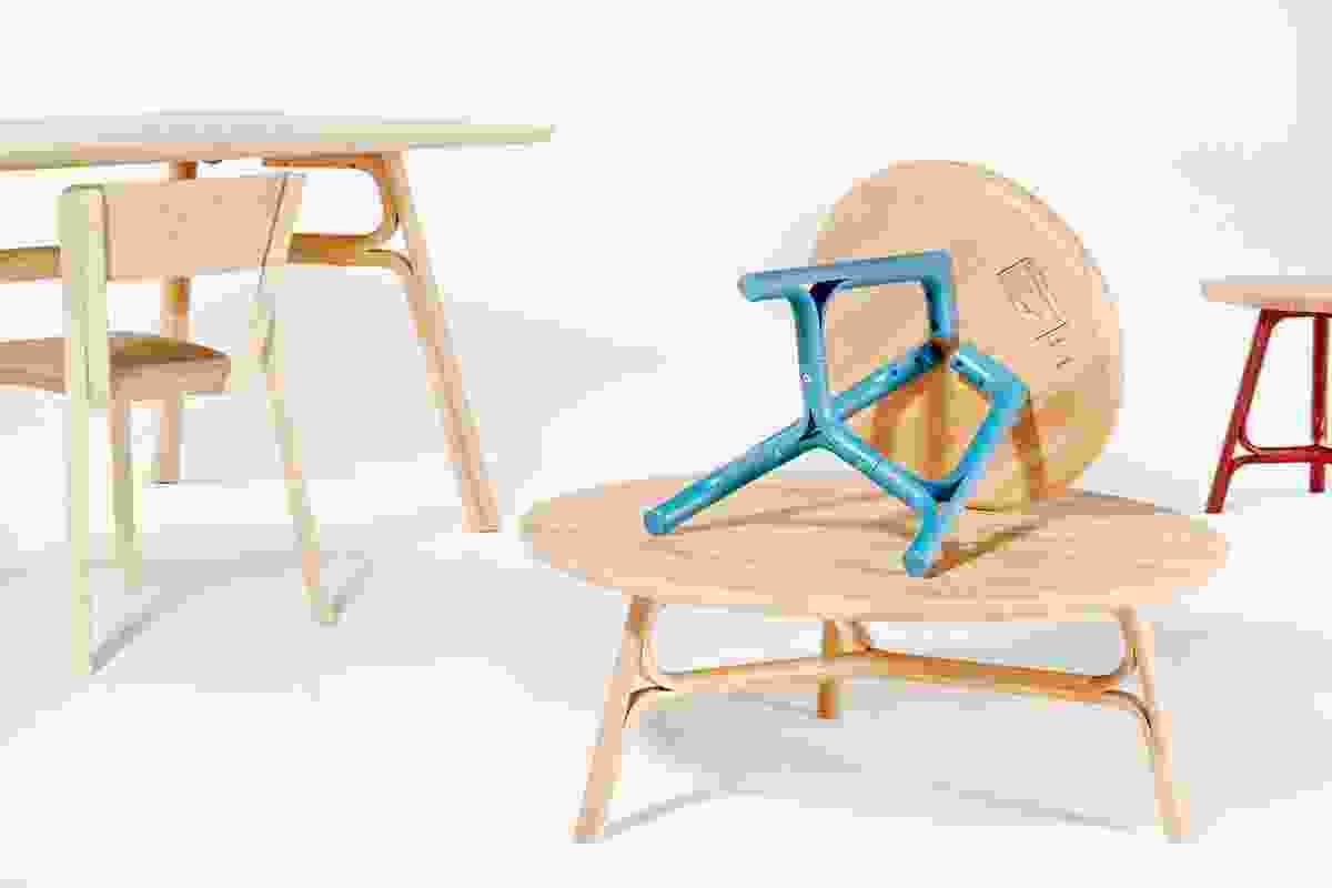 Justin Hutchinson Flow tables for Dessein Furniture in natural rubberwood and blue.