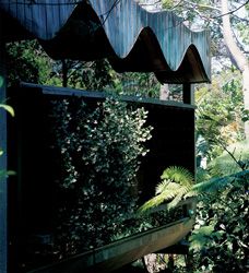 Reason and emotion. The sinusoidal ceiling/roof and hovering concrete panel tucked into the bush.