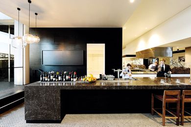 The bar’s design is clean and simple, with hand-blown glass ball lights suspended above.