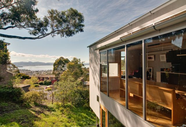 Both houses are oriented toward impressive views of the Derwent River.