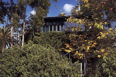 Hank and Julie's own home, 25th Street House in Santa Monica, California, features many moving parts that open it up to the outside. Obscured by landscape, the house only offers glimpses of itself.