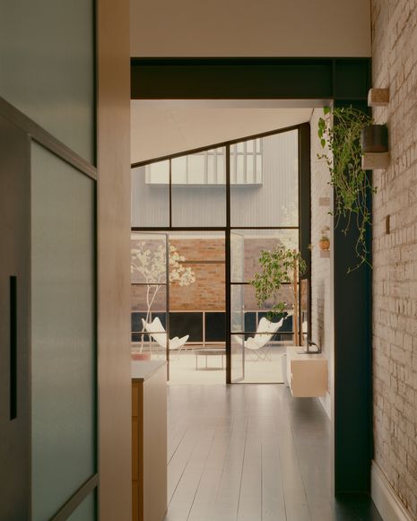 Materials – including stones from the old lean-tos – were recycled and reused in the extension.