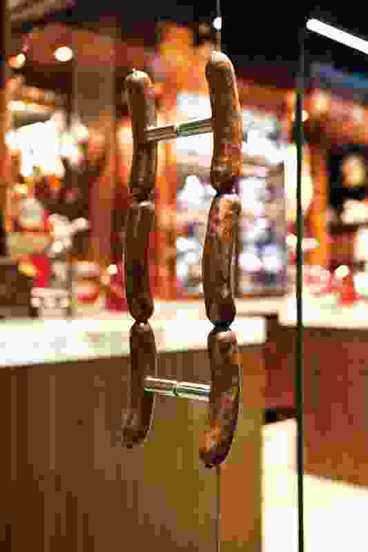 Sausage-link door handles bring a touch of humour to the shop.