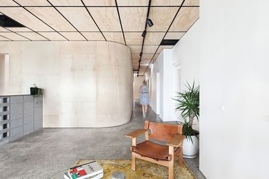 The Bunker houses two companies on the upper level. On entering the building company's side of the office, visitors are greeted with a palette of concrete and plywood.