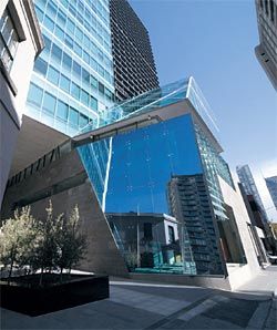 The Urban Workshop provides civic space within a commercial programme. Little Lonsdale Street entrance. The canted mirror reflects the Oddfellows Hotel building to the right.