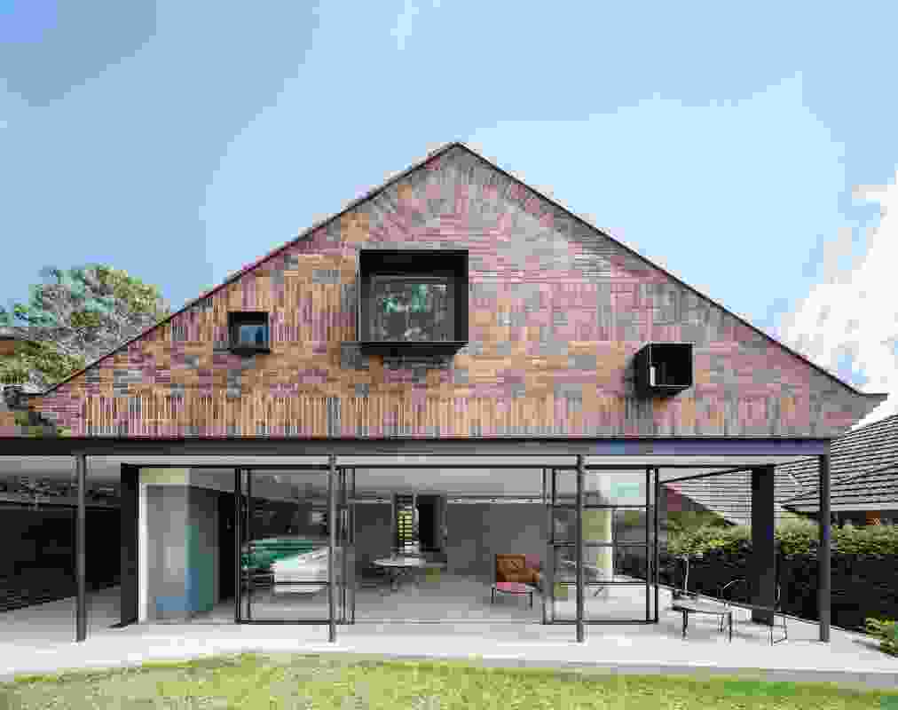 The rear elevation of the addition comprises a “suspended brick tapestry” over a lightweight pavilion.