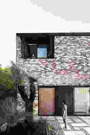 At Courtyard House, recycled brick extends and expands an existing cottage.