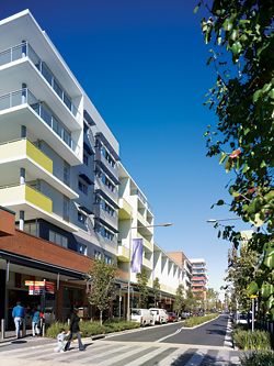 View down Main Street, showing the integration of apartments and retail premises.