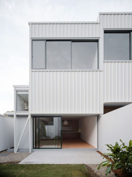 Each home has a two-storey form, with the ground-floor living, kitchen and dining spaces opening onto garden spaces.