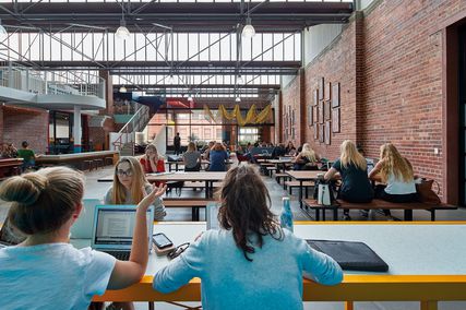 The student hub’s internal face brick walls are topped with a sawtooth roof that provides great natural light.