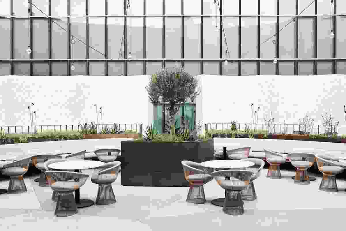The ideal place for a long lunch, the courtyard features suspended festoon lighting and bronzed planters.