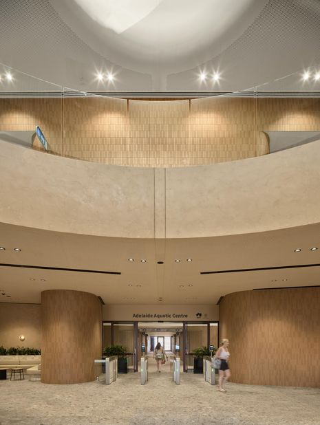 Materially, mass timber and a restrained palette create robust yet light‑filled spaces, offering spatial generosity and a sense of softness far removed from the rusting tubular steel aquatic centres of old.