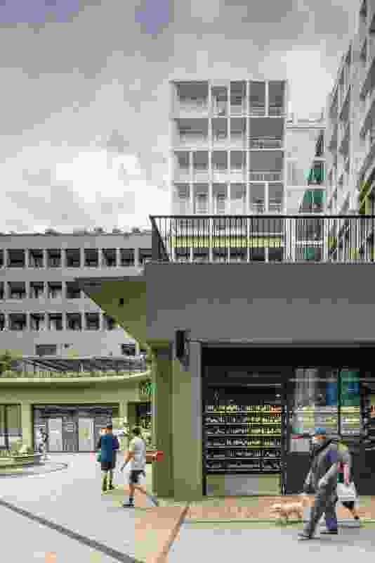 The green tint used at the bottom of Perkins and King creates a warmth at street level and dissipates the bulk of the white form above.