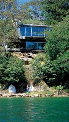 The water edge facade. The house snuggles into the bush on the northern tip of Sugarloaf Point, Castlecrag. 