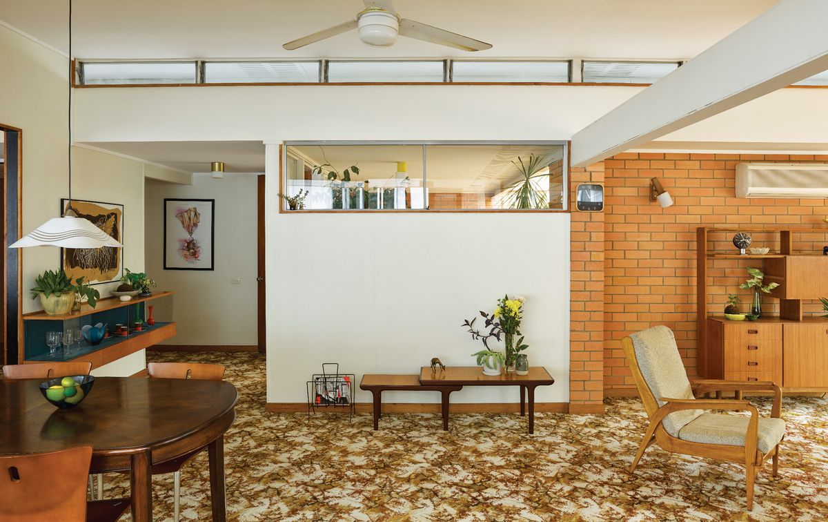 Primary windows protected by wide overhangs and cleverly conceived clerestory windows let in an even wash of light.