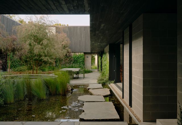 Courtyards like this lush central garden function as reference and refuge on a large, exposed site.