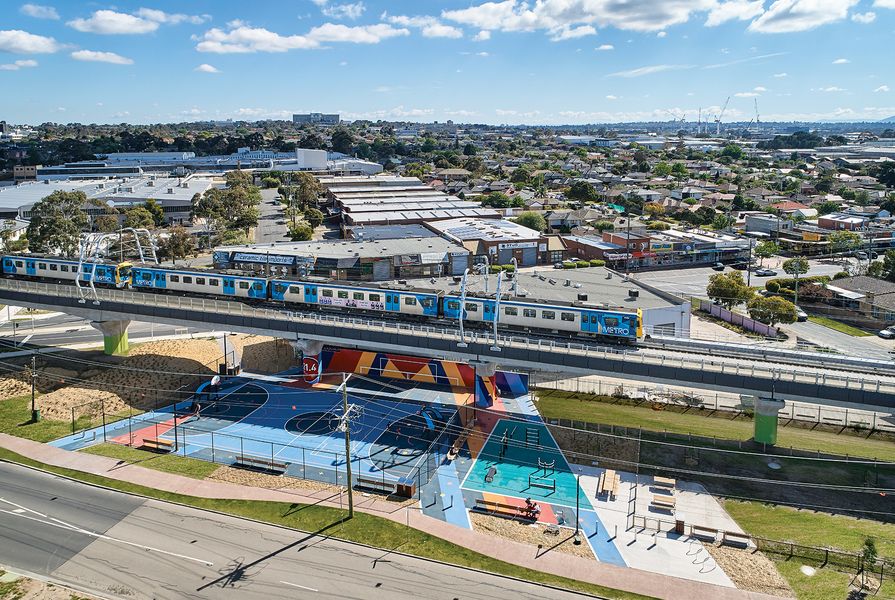 The Caulfield to Dandenong project creates 8.4-kilometres of linear park beneath the now-elevated rail line.