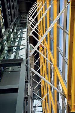   Looking up the glazed lift shaft that rises up the atrium. Image: Emma Cross 