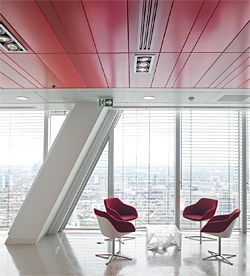 Metal ceiling system finished in three different shades of red.