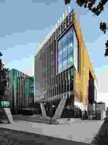 The repurposed buildings at Adelaide Botanic High School by Cox Architects and DesignInc are linked to a new seven-storey structure by a glass atrium.