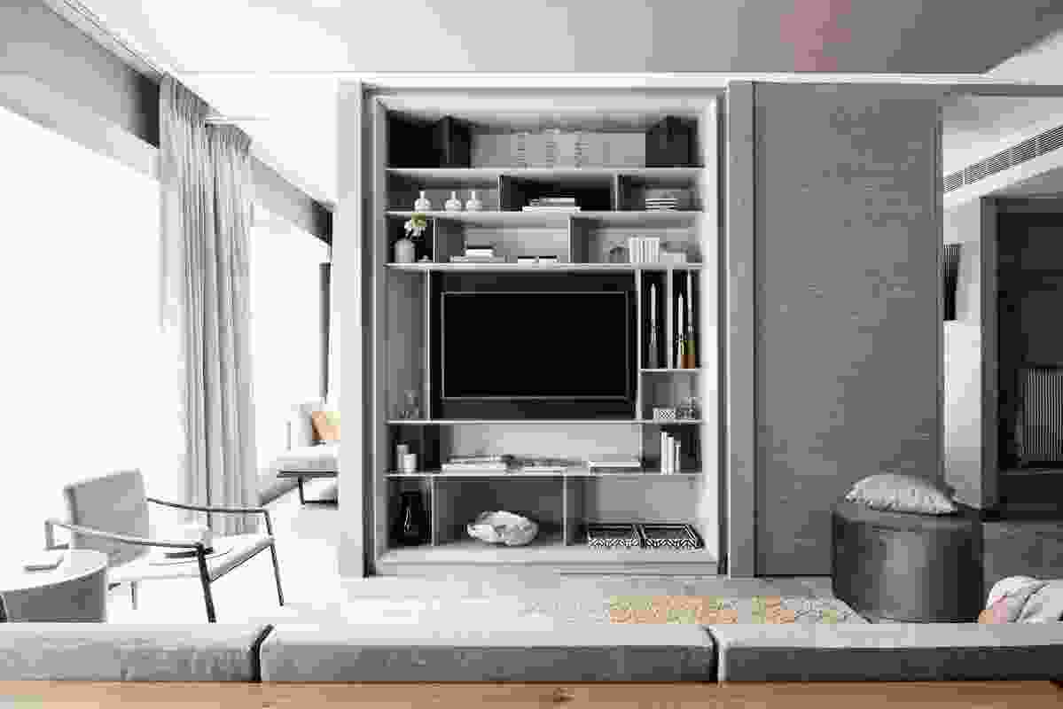 In the bedrooms, custom-designed open joinery incorporates storage and the television in an unobtrusive way.
