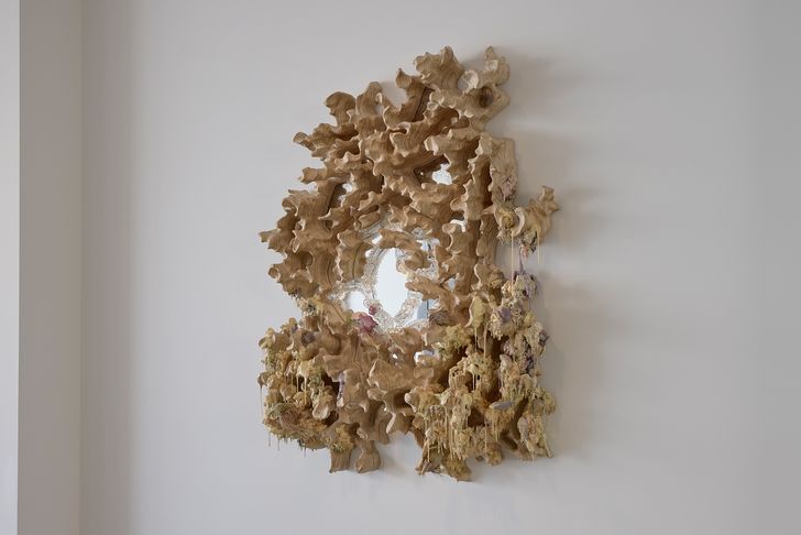 Experimental designer Tadeas Podracky’s oozing wood and mixed media mirror at FIN Gallery.