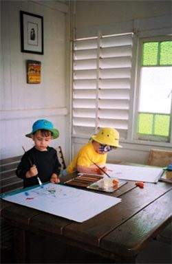 Shaneen Fantin’s nephews, Gus and Primo, painting on her front verandah.