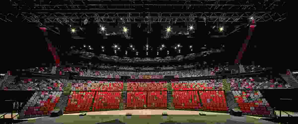 The ICC Sydney Theatre is fan-shaped in plan, its 8,000 red and grey towering seats enhancing the drama of hosted events.