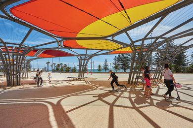 Along the upper promenade, arbours by Chaney Architecture that feature a colour pattern developed in collaboration with Aboriginal artist Sharyn Egan provide a flexible space for events.
