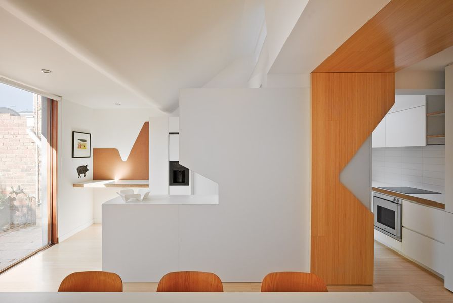 The eastern end of the house is characterized by cut-out shapes, spaces that fold into each other and natural light mediated by double glazing.