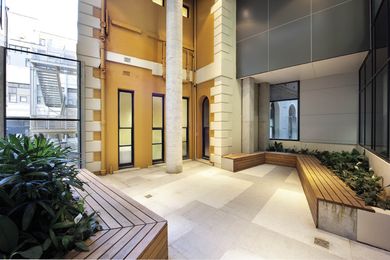 A courtyard between the new centre and the adjacent Delacy building, revealing the heritage features of the existing structure.