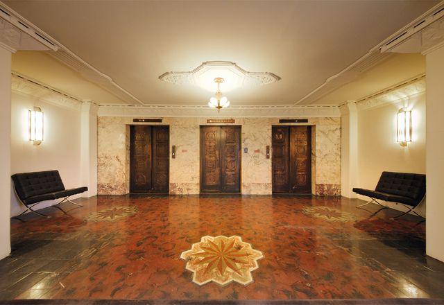 The level-11 lobby with original marble inlay flooring.