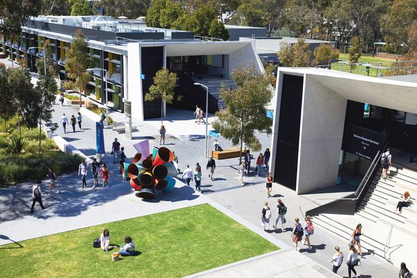Students stroll through the North West Precinct at Monash University’s Clayton campus, designed by Outlines Landscape Architecture