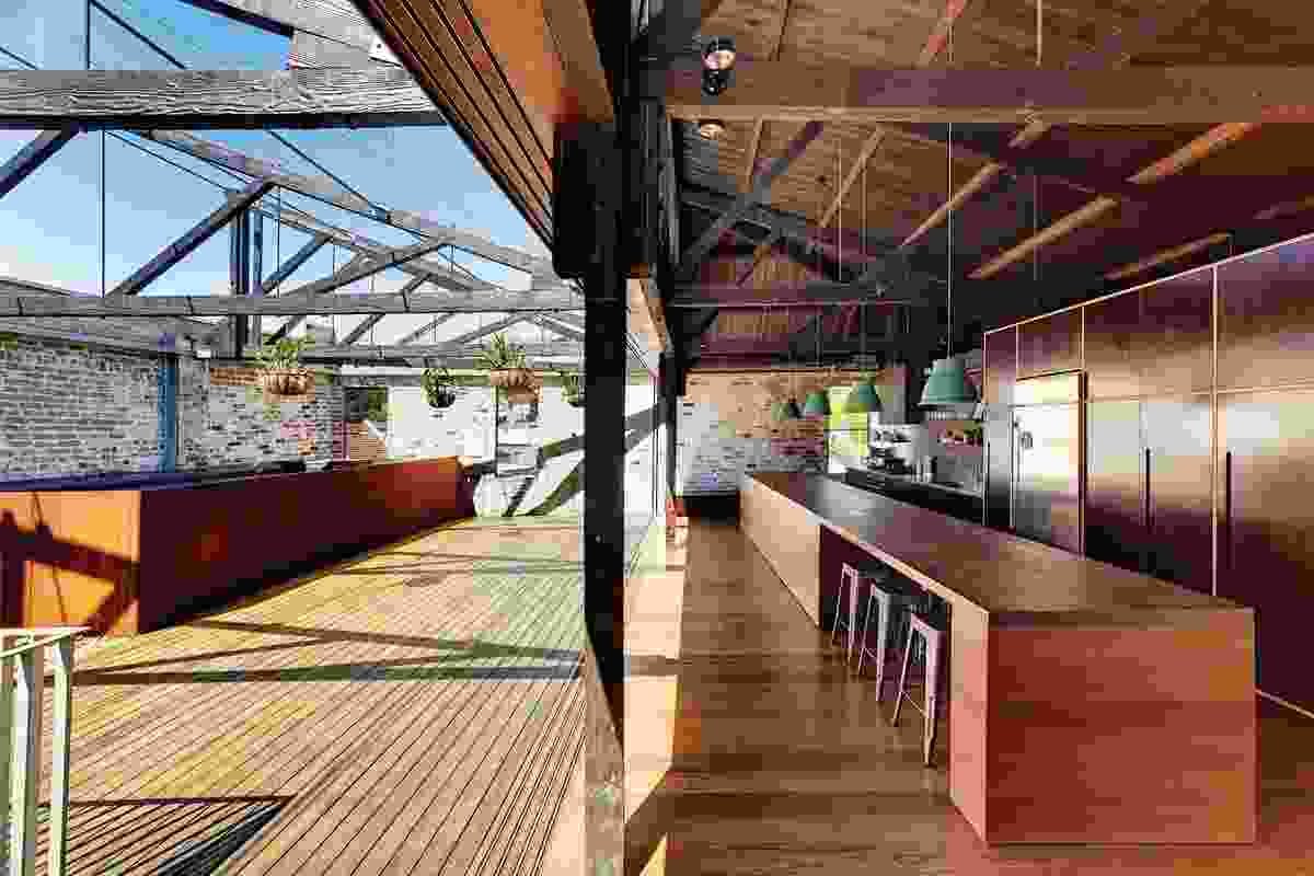 Lilyfield Warehouse (2012): The first-floor living area opens onto a deck, the reuse of existing materials connecting the house to the history of the site.