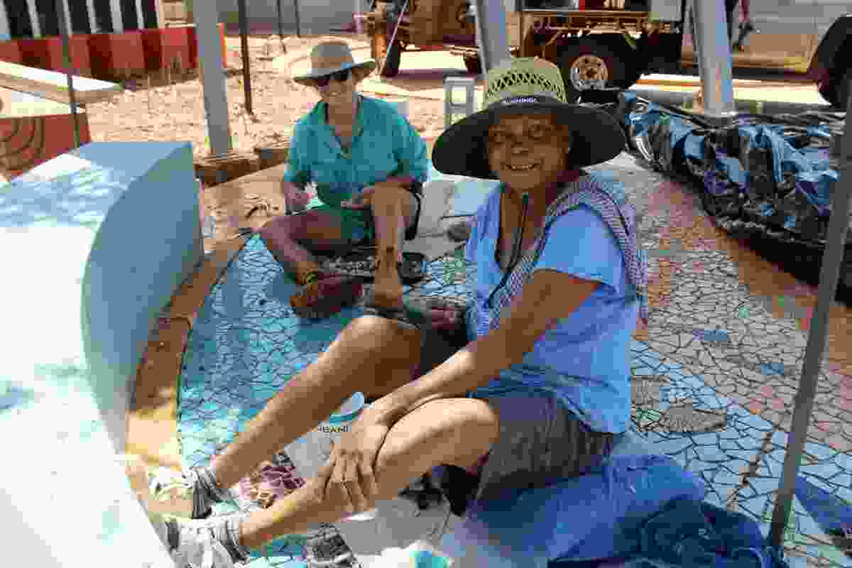 Terricita Corpos and Vanessa Margetts working on the mosaic at Liyan-ngan Nyirriwa.